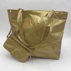 Shiny GOLD Aj Valenci tote bag with detachable wallet clutch, zip top